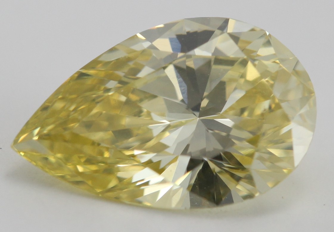 Fancy Yellow Color 1.15 Carat Pear Shaped Diamond, HPHT Treated and VVS2 Clarity